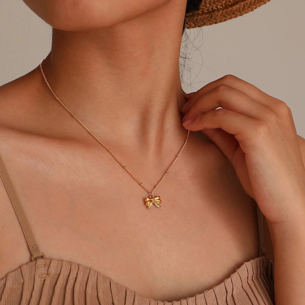14k Dainty Feminine Bow Necklace - Aryomi