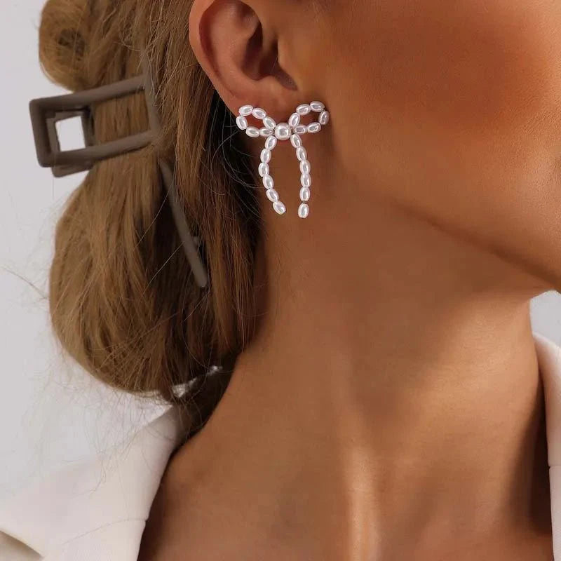 Iconic Dainty Pearl Bow Earrings - Aryomi