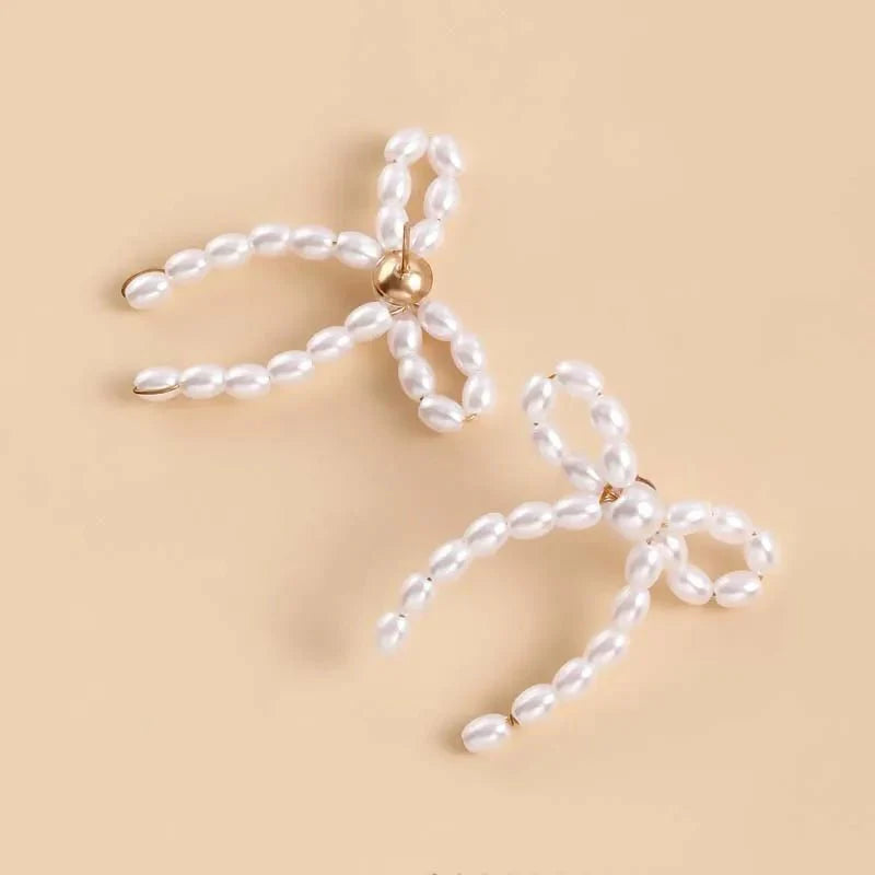 Iconic Dainty Pearl Bow Earrings - Aryomi