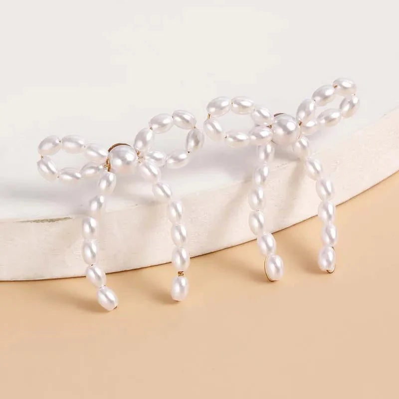 Iconic Dainty Pearl Bow Earrings - Aryomi