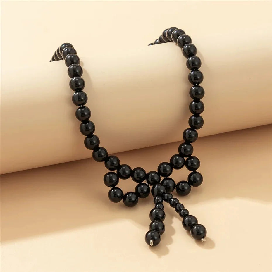 Iconic Dainty Pearl Bow Necklace - Aryomi
